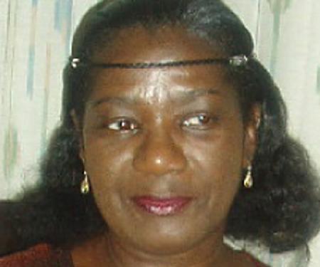 Woman smilin, wearing a headband 