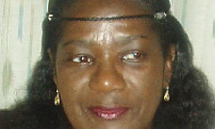 Woman smilin, wearing a headband 